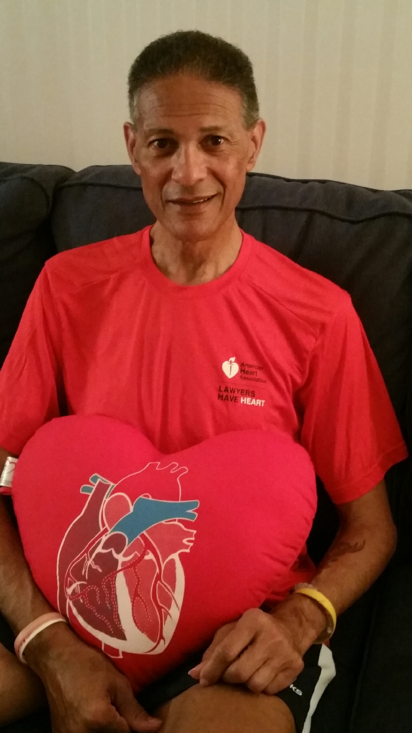 Man with red heart pillow